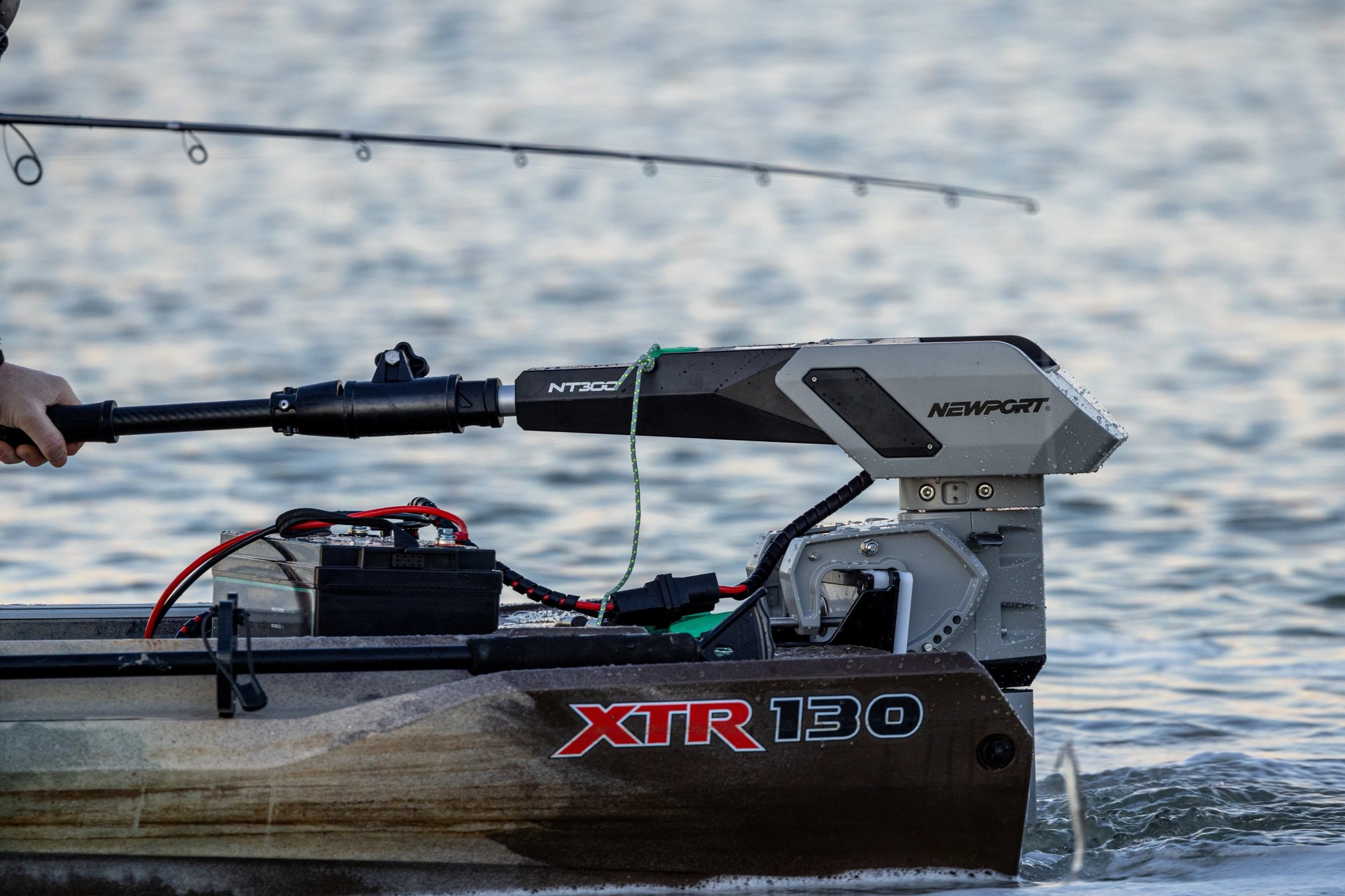 Fishing boat with Newport XTR 130 motor on a body of water